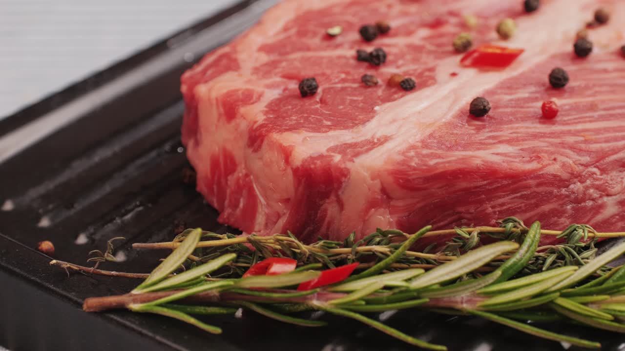 Raw Steak with Herbs and Spices Ready to Cook