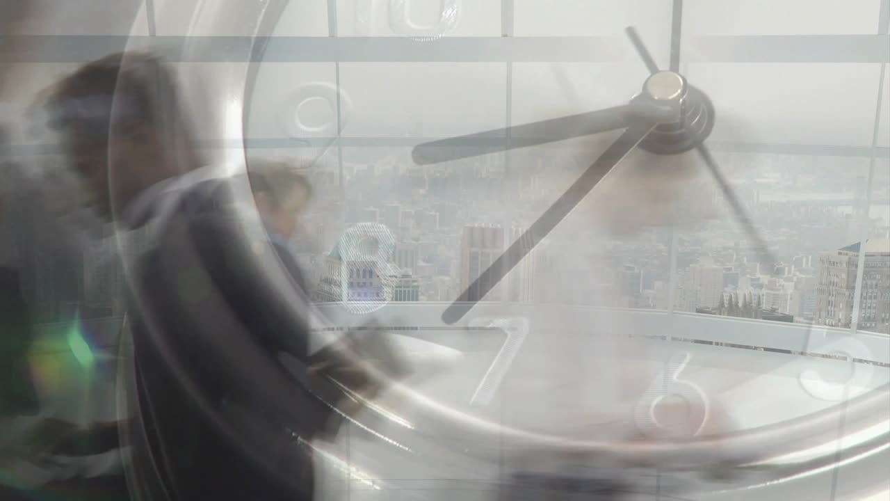 Clock hands rotating initiating business staff walking across office floor behind clock overlay