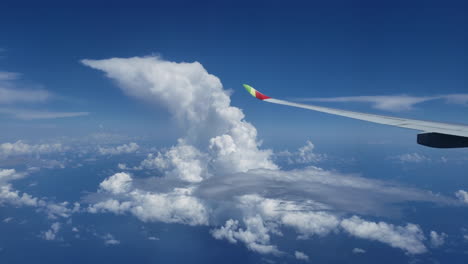 looking out plane window flying over nice clouds scenic