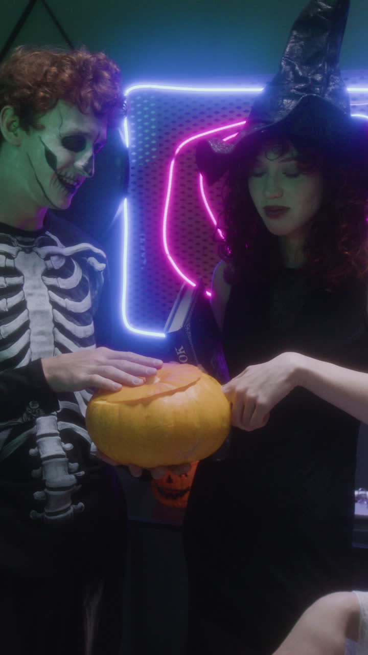 Halloween Celebration with Witch and Skeleton Costumes