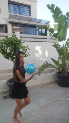 woman playing with a ball outdoors