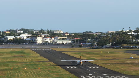 an atr 72-600 light airplane takes off at the noumea magenta aerodrome to transport tourists to the loyalty islands