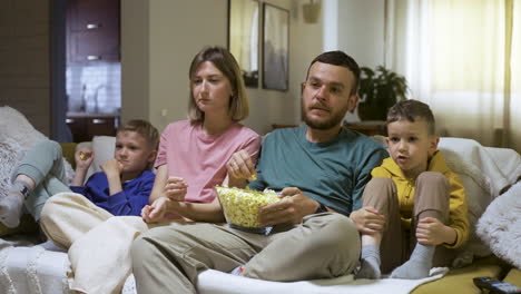 family enjoying movie