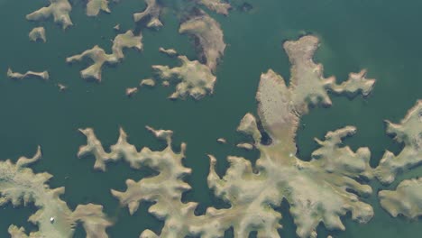 panoramic aerial view of karamchat dam, offering a sweeping view of the dam, river, and surrounding hills.