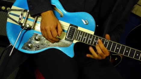 guitar being played by rock musician