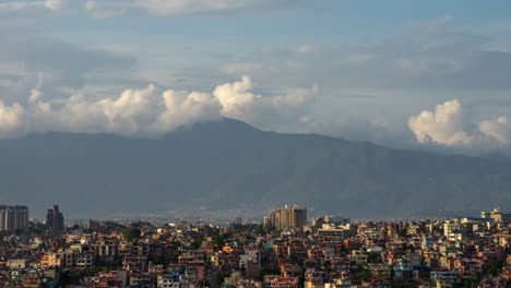 a time-lapse video in 24p showing the clouds rolling over the himalaya mountains and the city of kathmandu, nepal