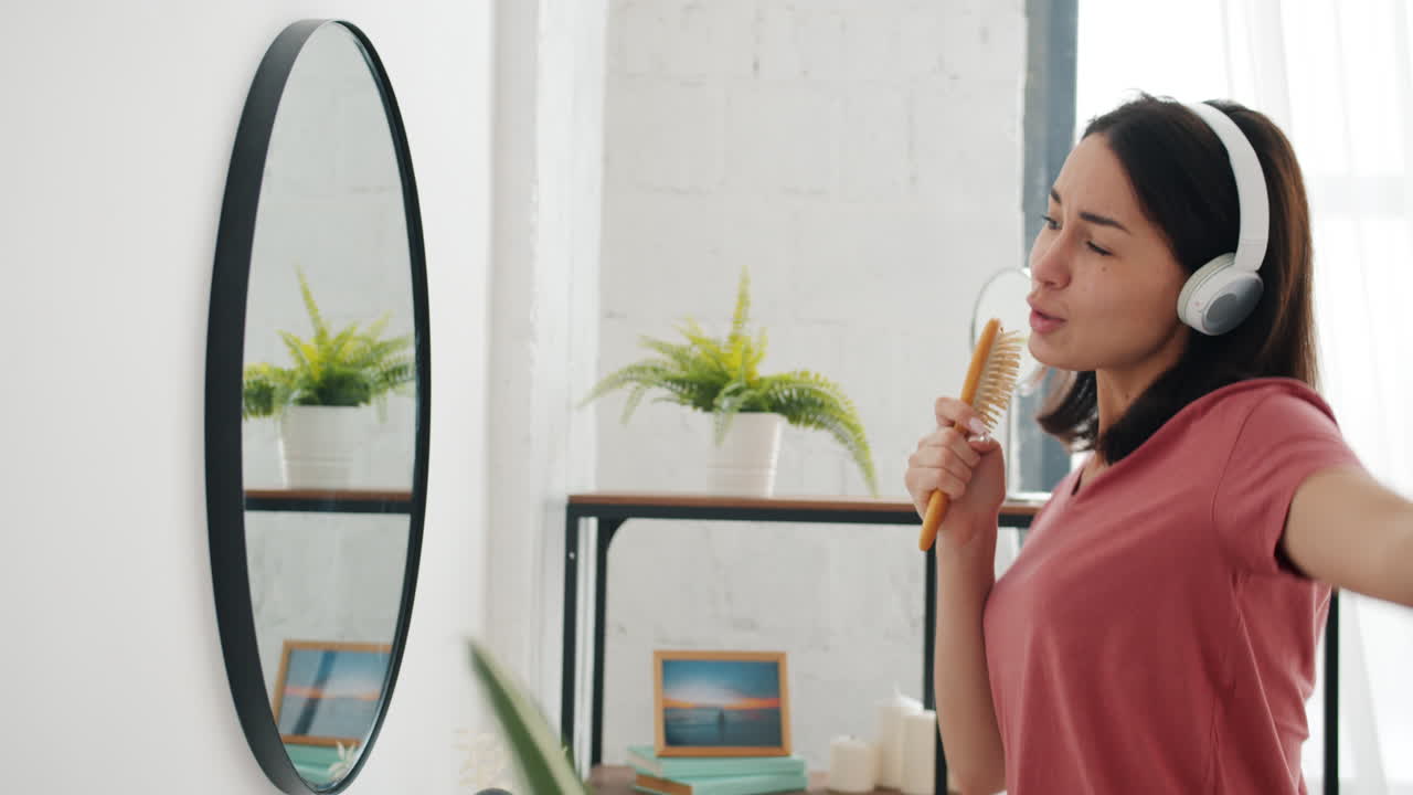 Woman Singing and Brushing Hair in Bathroom