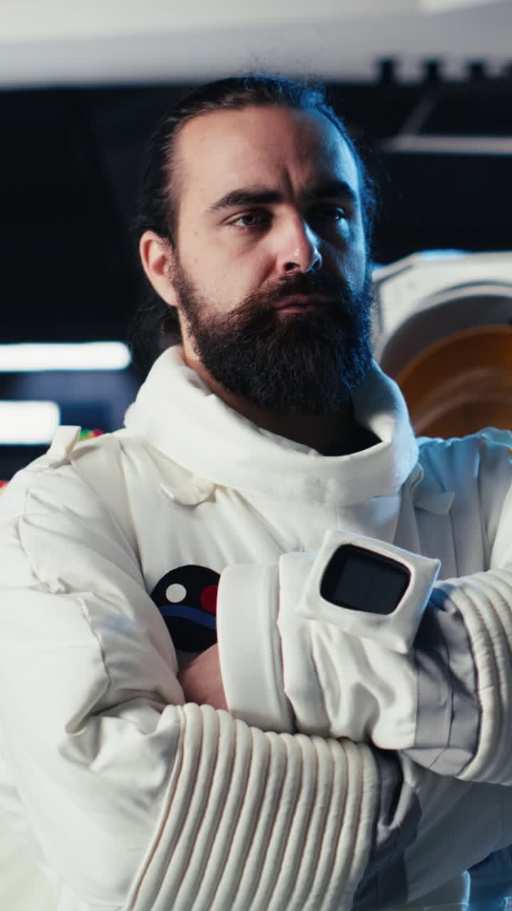 Vertical video Upbeat astronaut greeting researchers during videocall presenting research data