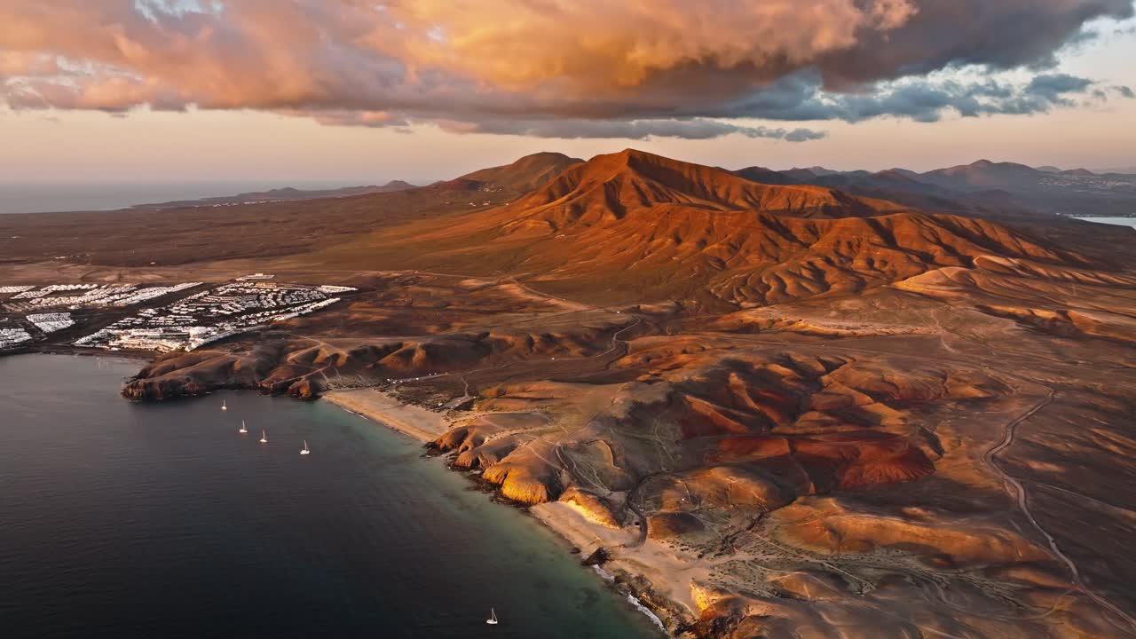 Stunning drone dlight over Lanzarote at sunset featuring Playa Mujeres and Playa Papagayo beaches.