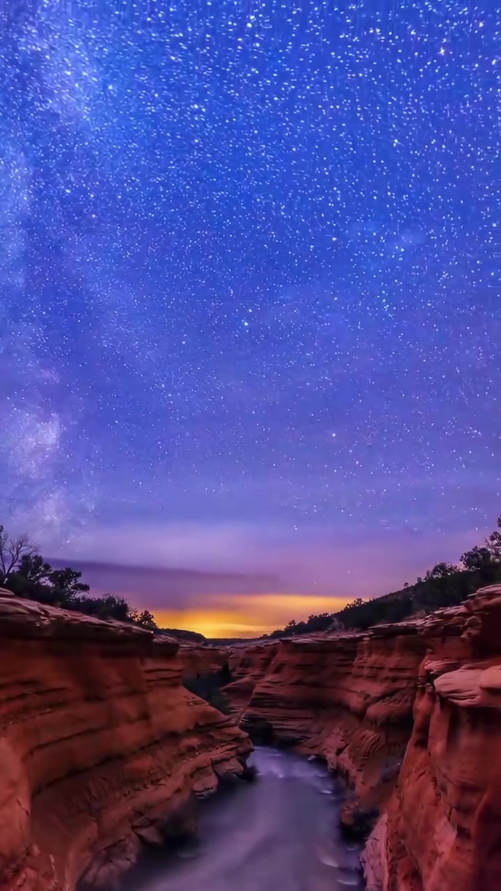 Time Lapse of Star Trails Over a Desert Canyon at Sunset