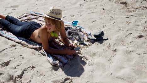 Teenage-girl-relaxing-on-beach-4k