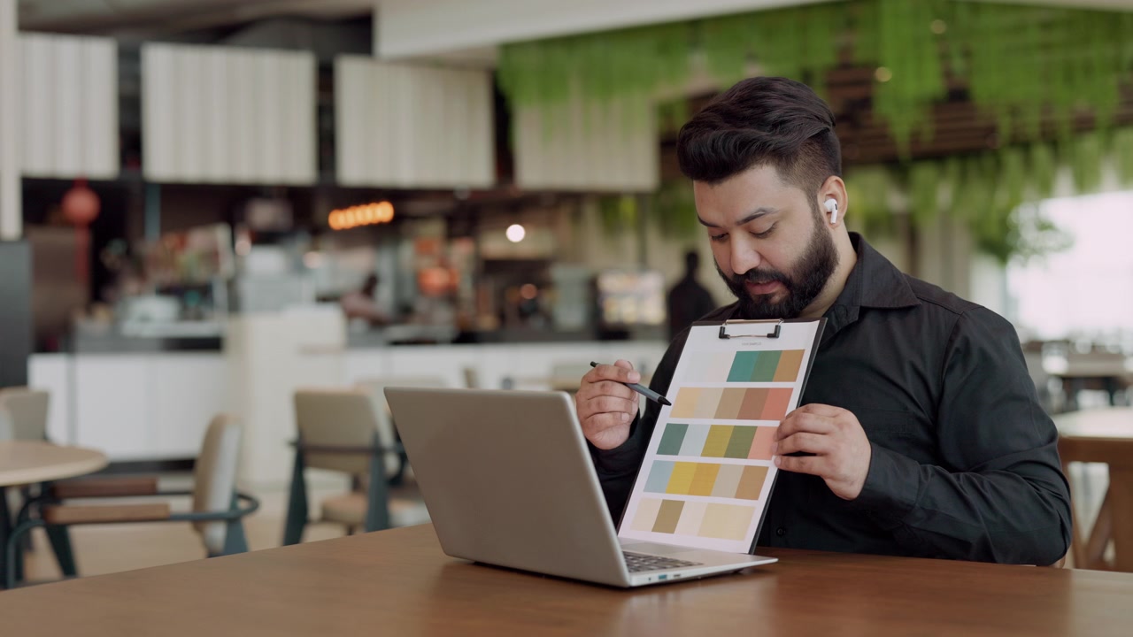 Graphic Designer Discussing Color Palette on Video Call