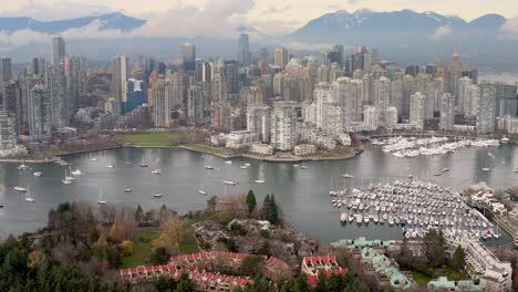 boats dock at heather civic marina with downtown vancouver skyline at sunrise in british columbia, canada