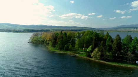 Slanica-island-with-its-historic-Baroque-church-on-Oravska-Priehrada-dam,-Slovakia