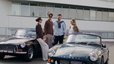 friends enjoying vintage cars