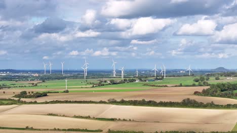 Wide-angle-aerial-view,-Wind-turbines-operating-Netherlands-countryside