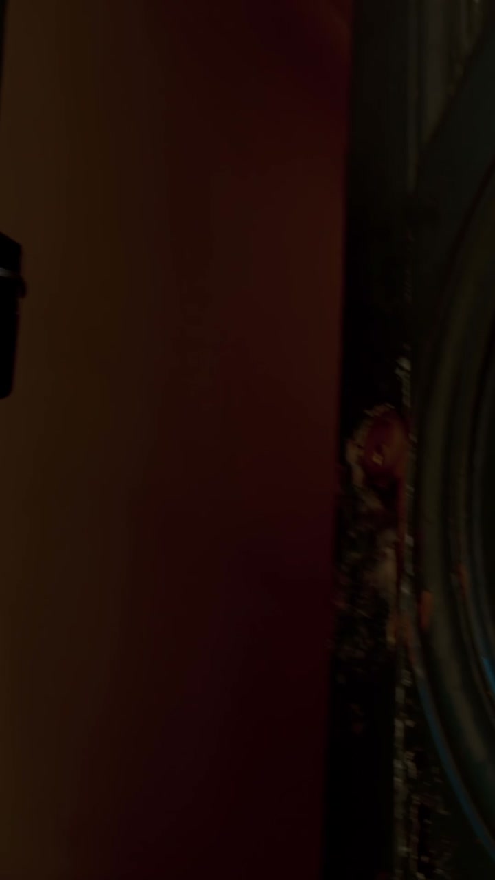 Person opening a door and walking down a street