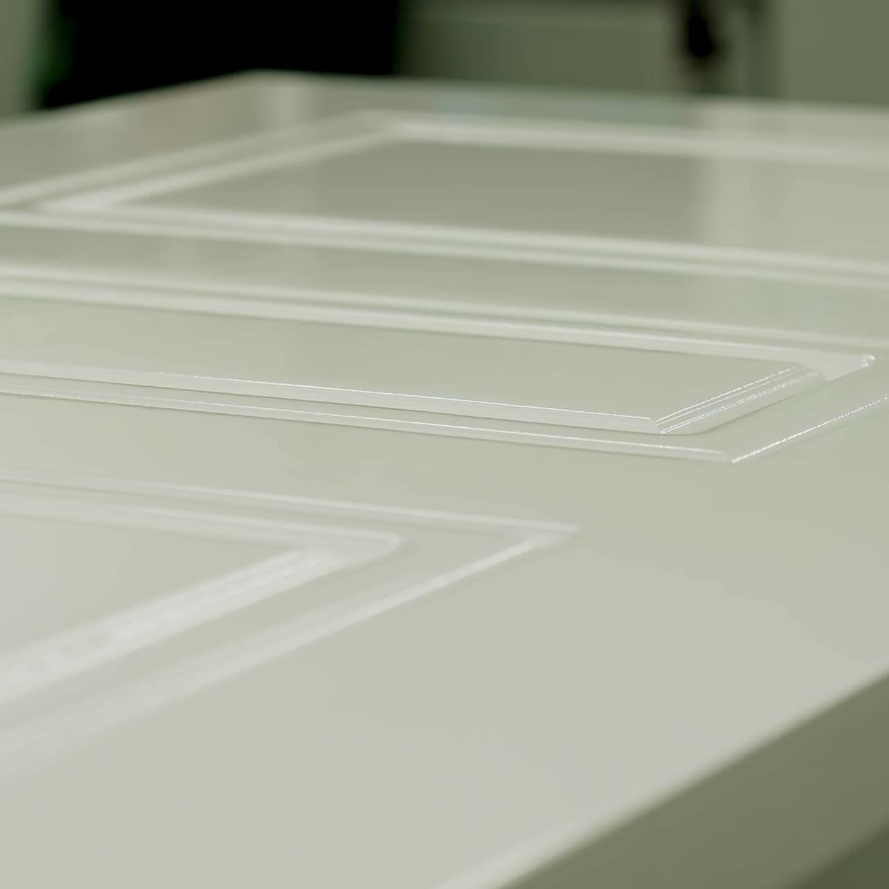 New white door in workshop. Production of doors. Wooden home door inside the manufacturing. Close-up.