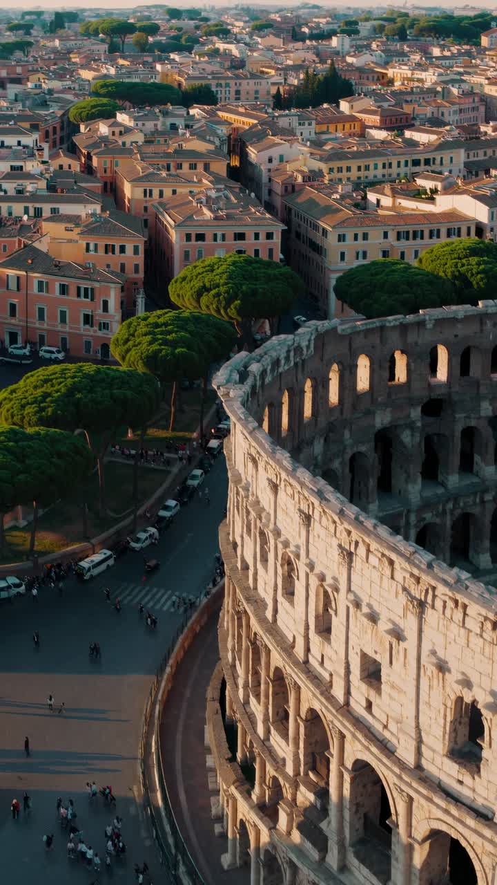 Aerial view video of the Colosseum, capturing its ancient architecture against a backdrop of city
