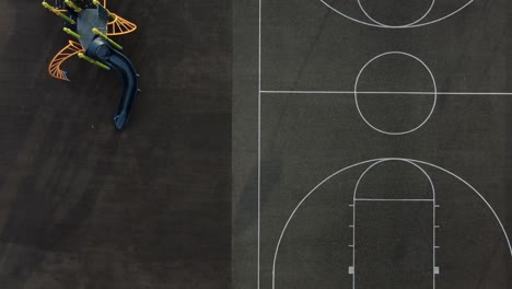 aerial top down of playground at school, daycare, jungle gym and basketball court birds eye view