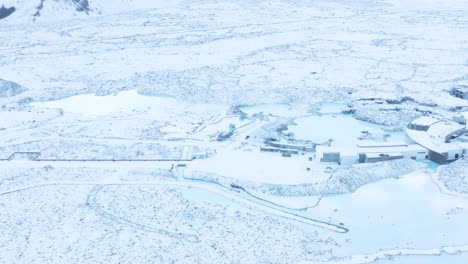 aerial of famous blue lagoon spa in snow covered landscape of iceland