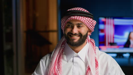 arab man in traditional attire at home