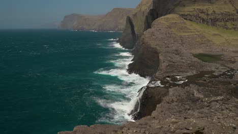 Dramatic-Cliffside-View-Of-Geitaskoradrangur-on-Vágar---aerial-shot