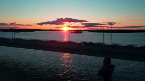 aerial view of traffic on the lapinlahti bridge, in helsinki, summer sunset in finland