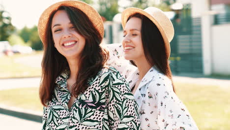 two women friends smiling outdoors