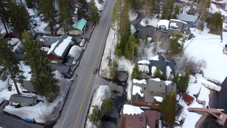 car driving on donner pass road in snowy truckee, california