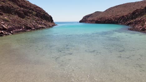 aerial: local fishing boat moored on remote mexican beach, espiritu santo, baja california sur