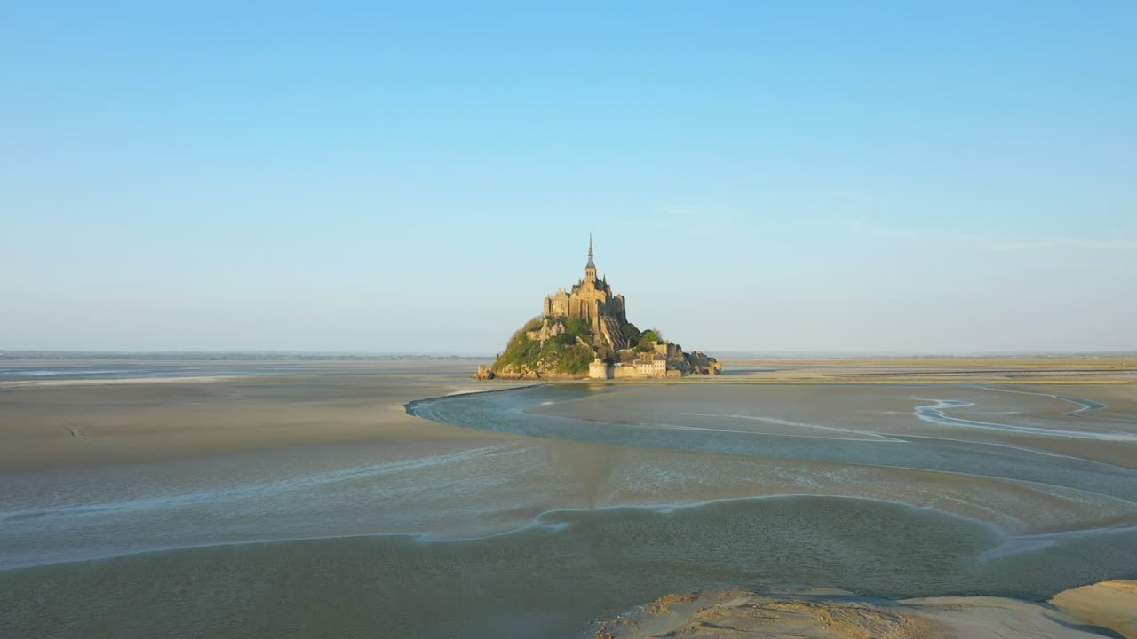 The bay of Mont Saint Michel and its sand dunes in Europe, France, Normandy, Manche, in spring, on a sunny day.