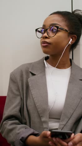 woman using smartphone on public transport