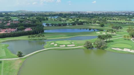 trump national golf club doral, green meadows, lakes, florida, usa. aerial forward