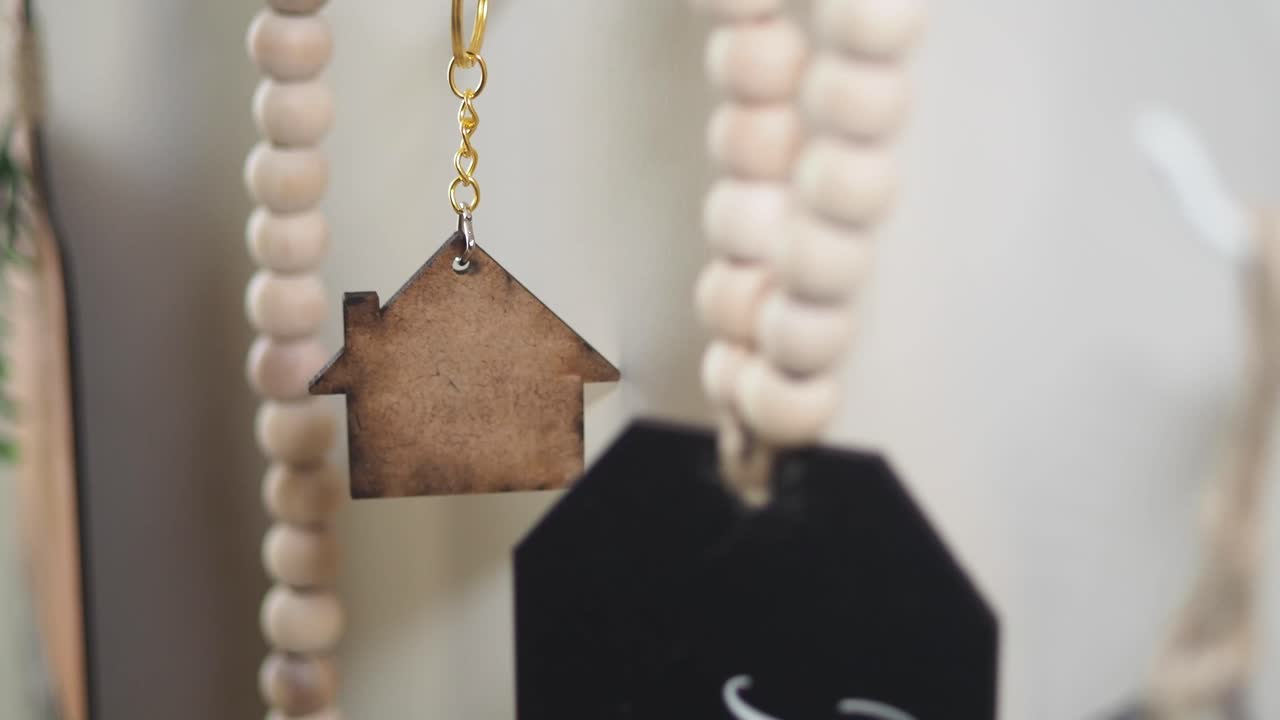 Wooden house keychain on bead garland