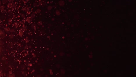 red light shining on dust particles in the air.