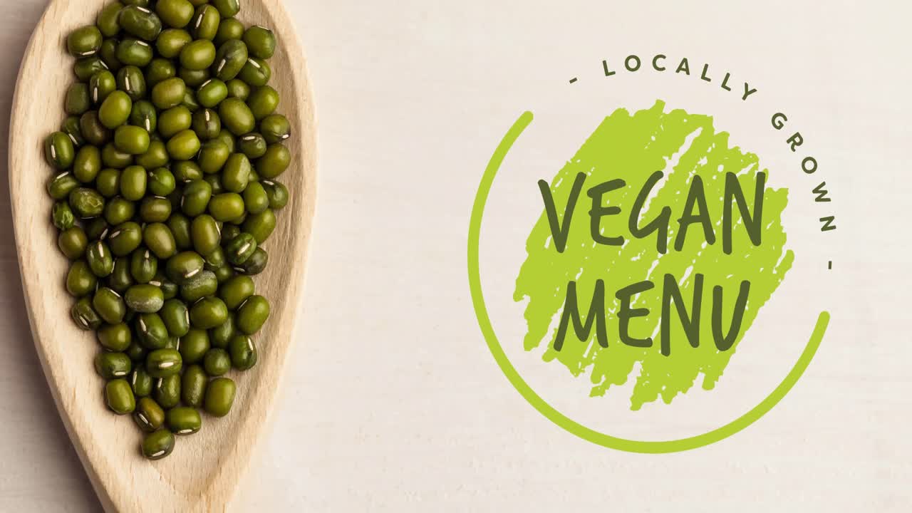 animación del texto del menú vegano en verde sobre brotes verdes orgánicos frescos en un cuenco de madera