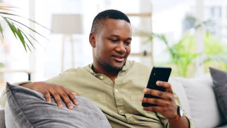 Black-man,-phone-and-relax-on-sofa-for-social