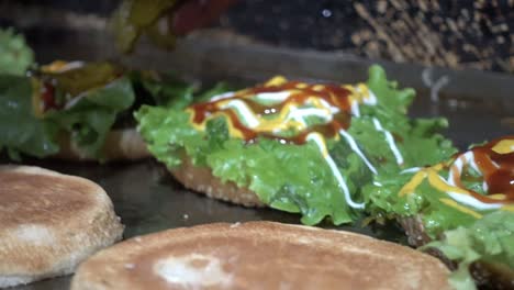 close-up shot of burger buns being toasted and prepared on a hot plate