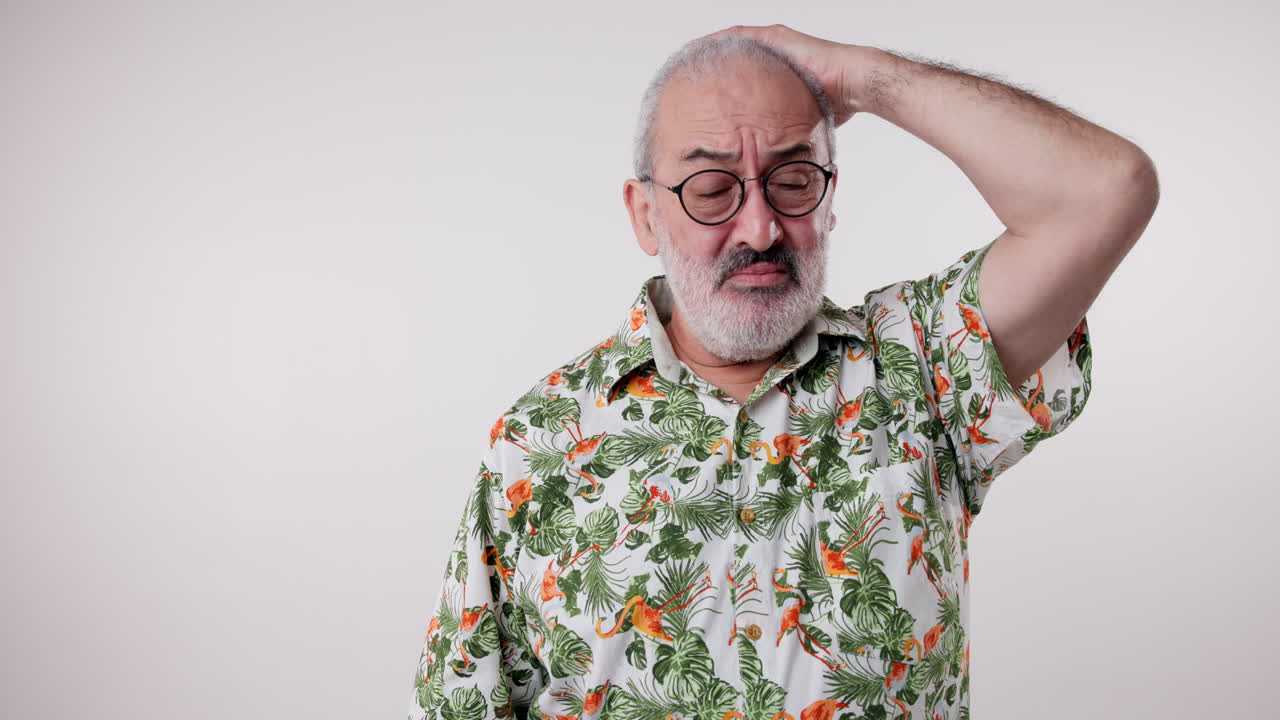 Portrait of an elderly man wearing a Hawaiian shirt