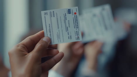 person holding a document or id card