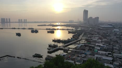 sunrise over a busy port city