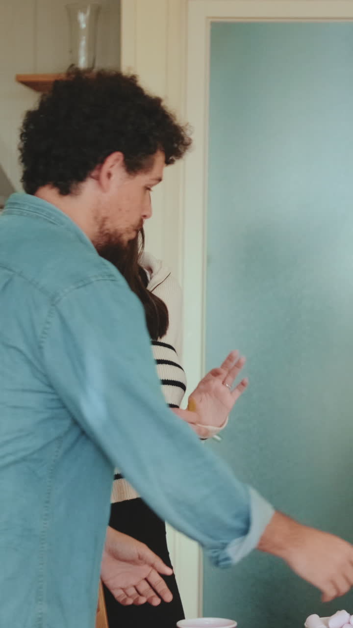 A woman in a striped sweater smiling indoors