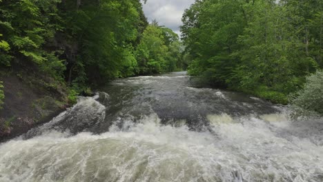 droning upriver near buttermilk falls in new york