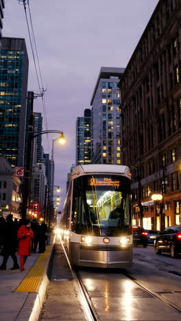 evening city scene with a bright streetcar