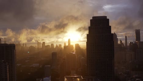 beautiful sunset with sunflares in the bangkok skyline in thailand