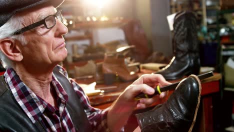 Shoemaker-repairing-a-shoe