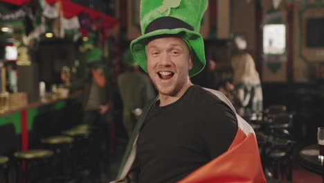 man dancing with irish flag