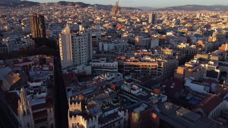 barcelona skyline at sunset with la sagrada familia in background. aerial view