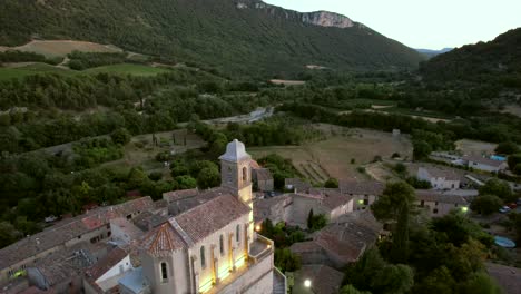 the chapel notre-dame de la consolation, built in 1894 atop a rocky spur overlooking a village in pierrelongue